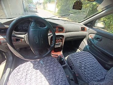 46 kuza: Kia Clarus sedan sökülür - Kuzov: 4 qapılı sedan, tünd yaşıl rəng - — 6