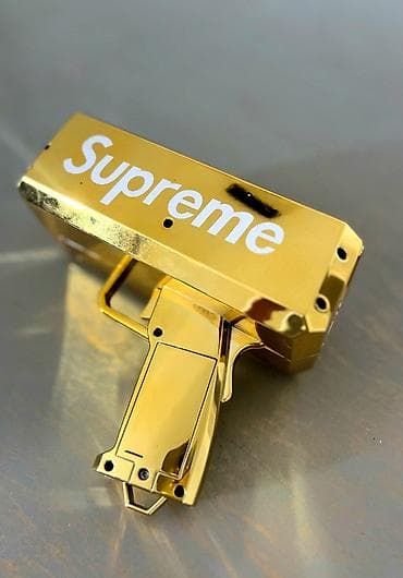 oyuncaq kassa: Məhsul: Supreme qızılı “Money Gun” (pul atıcı) Təsvir: - Parlaq — 1