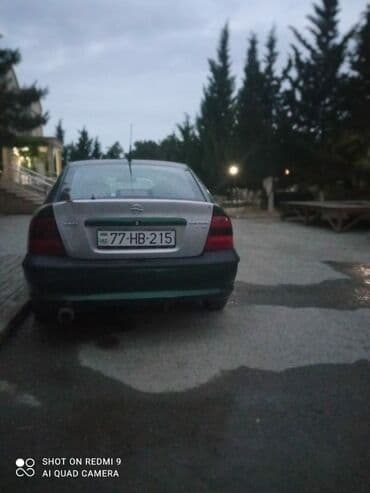 maşın danqratı: Opel Vectra: 1.6 l | 1996 il Sedan — 2