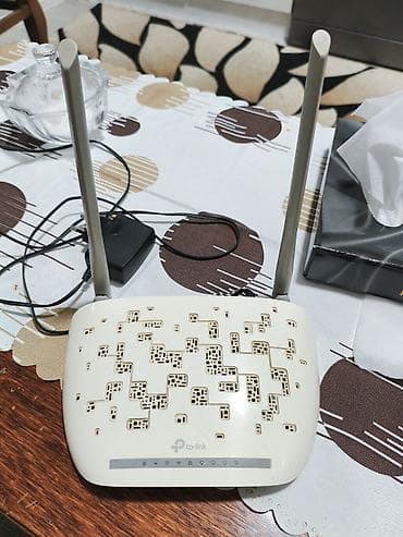 keenetic dsl: TP-Link Wi‑Fi router - Model xətti: TP-Link (üstdə loqo və idarəetmə — 1