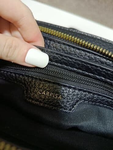 купить бу чемодан: Рюкзак от бренда Carpisa. Модель сделана из эко кожи, имеет магнитную — 4