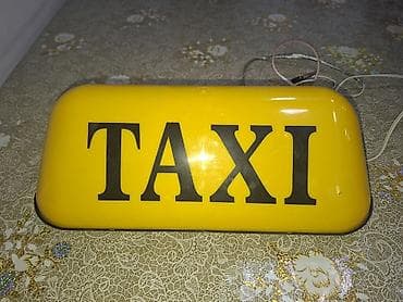 Taksi dam işığı – sarı korpus, “TAXI” yazılı. - Avtomobilin