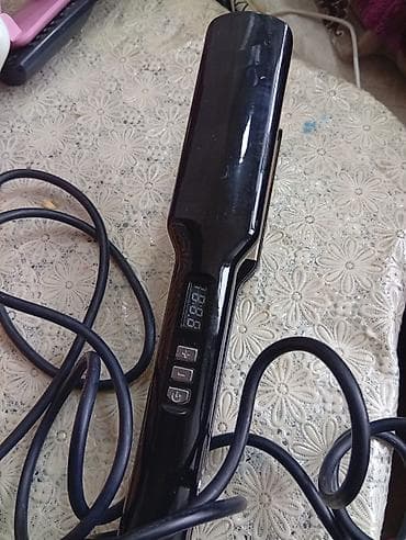 samsung a50 kabrolari: Şəkillərdə görünən qara rəngli saç düzləşdirici, saçların hamarlanması — 2