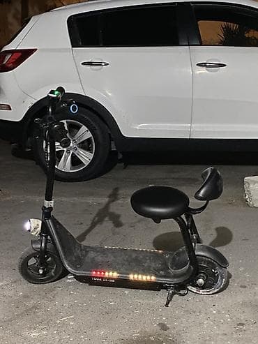 Oturacaqlı elektrik skuter -saatda 20 km surerle hereket edir — 3