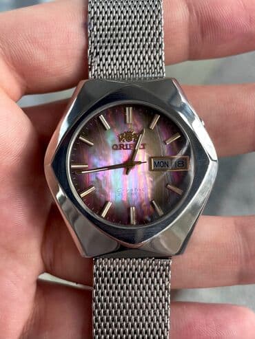 saat gumuş: İşlənmiş, Qol saatı, Orient, rəng - Bənövşəyi — 1