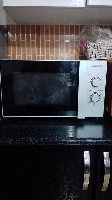 Mikrodalğalı sobalar: Mikrodalğalı soba Korkmaz, Ayrıca dayanan, Mikrodalğalar ilə, rəng - Qara, İşlənmiş — 1