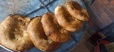 Bitkilər: Təndirdə işləmək üçün çörək qızardan tələb olunur. Gəncə təndiri — 1