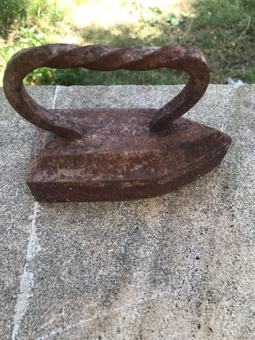 qədimi qəpiklər: Qədimi daş ütü agır materialdı antik 50 manat biraz paslayıb onun — 2