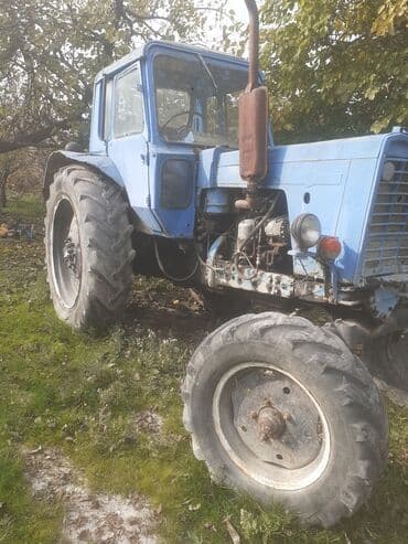 yuk avtomobilleri satisi: Mavi rəngli təkərli traktor Texniki xüsusiyyət və üstünlüklər: - — 3