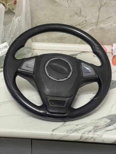 Avtomobil sükanı - Material: plastik/deri teksturalı örtük, tutacaq