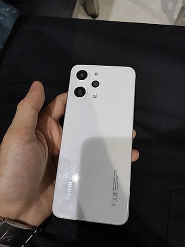 resmi not 9: Redmi smartfon – ağ rəng Xüsusiyyətlər: - Arxa tərəfdə üçlü kamera — 2