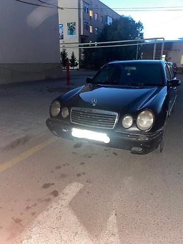 disk qabi: Mercedes-Benz E 320: 3.2 l | 1995 il Sedan — 2