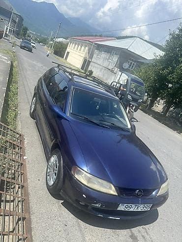46 kuza: Opel Vectra Caravan (Universal), tünd mavi rəng. Xüsusiyyətlər: - — 9