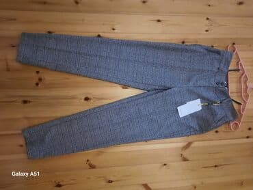 женские оранжевые брюки: 36 razmer Etiketi üzərindədir balaca olduğu üçün satılır — 2