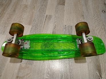 ucuz orjinal forma: Şəffaf neon-yaşıl plastik gövdəli penny skeytbord. Az istifadə olunub — 2