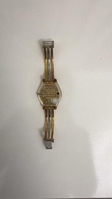 saat qolbaqlari: Qol saatı, Swatch, rəng - Qızılı — 4