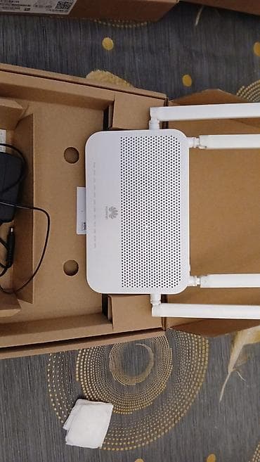 internet data: Huawei optik internet modemi/routeru. Şəkillərdə görünən ağ rəngli — 1