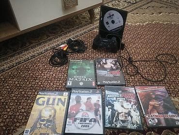 pleşteşin: PlayStation 2 (Slim) oyun konsolu seti Paket tərkibi: - PlayStation 2 — 2