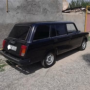 ucuz maşin: Model: LADA 2104 (universal kuzov) Rəng: qara Yanacaq: benzin Ötürücü — 4