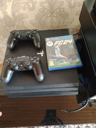 Ps 4 pro 2 pult orjinal fc 2024 disk 10 oyun icinde di 1 TB yadaşdi