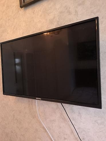 led televizorlar: Nikura divardan asılan televizor - Ekran: təxminən 32–40 düym arası — 1