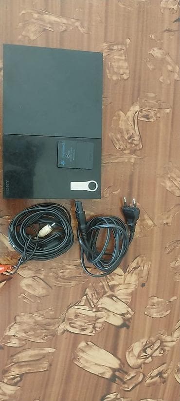 plesteşın 2: Se) Paketə daxildir: - PS2 Slim konsolu - 2 ədəd simli DualShock 2 — 4