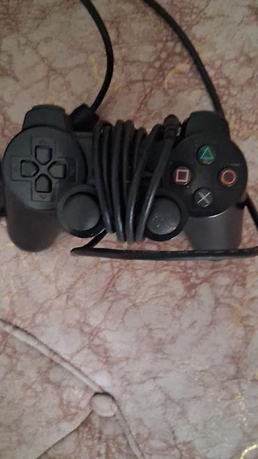 2 ci el 14 pro max: Sony PlayStation 2 Slim (gümüş rəng) Komplekt: - PS2 Slim konsolu — 1
