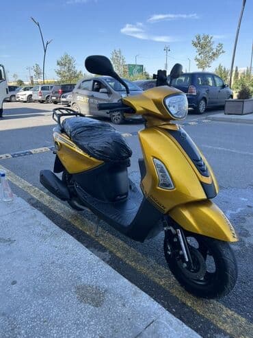 купить мопед в кредит: === PART 1: TEXTUAL DESCRIPTION === Sarı rəngli, müasir dizaynlı — 7