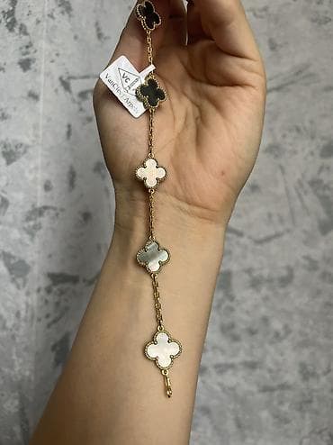 brend gun eynəkləri: Van clef qolbaglari xamelion ve tund yawil reng logosuna kimi var — 2