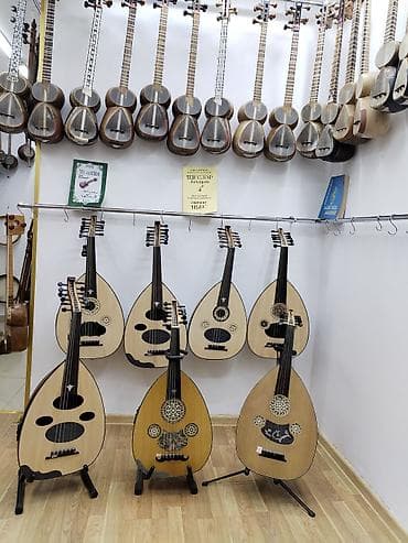 gitara sekilleri: Ud musiqi aləti qısaboyunlu leyta tipli, armudvari ladsız simli — 3