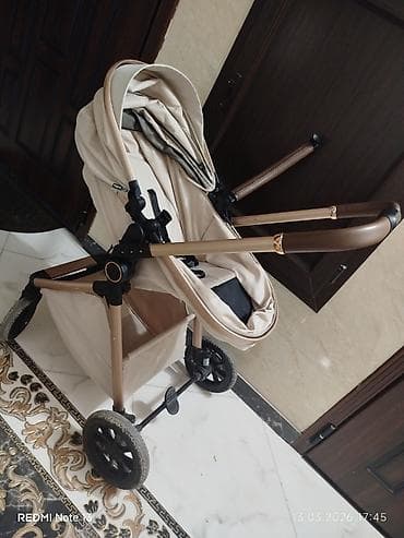 Коляски: Uşaq arabası – bej rəng, qızılı/qartal tərzində metal çərçivə və — 2