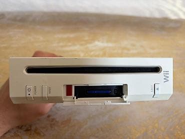 Nintendo Wii: Nintendo Wii komplekt dəsti Tərkibi: - Nintendo Wii (ağ) konsol - — 9