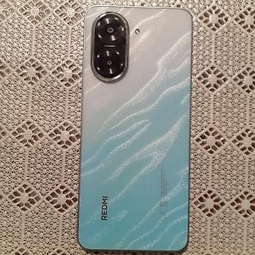iphone 16 qiymet: Redmi smartfon - Şık, maviyə çalan parıltılı arxa panel dizaynı — 2