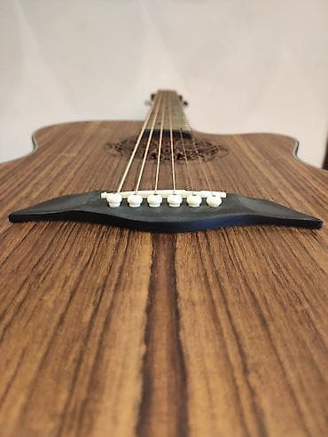 gitara simləri: Elektro akustik gitara Model:LG-09 Simlərin sayı: 6 Üst: Qoz ağacı — 1
