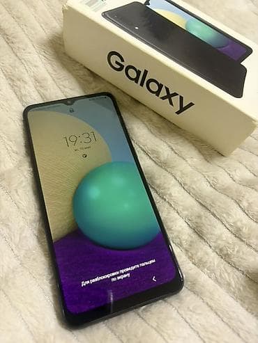 samsung a 100: Samsung Galaxy A02, rəng - Qara, İki sim kartlı — 1