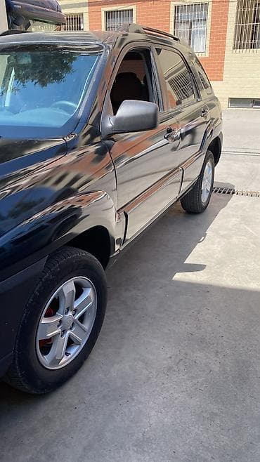 vito disk: Kia Sportage: 2 l | 2008 il Krossover — 4
