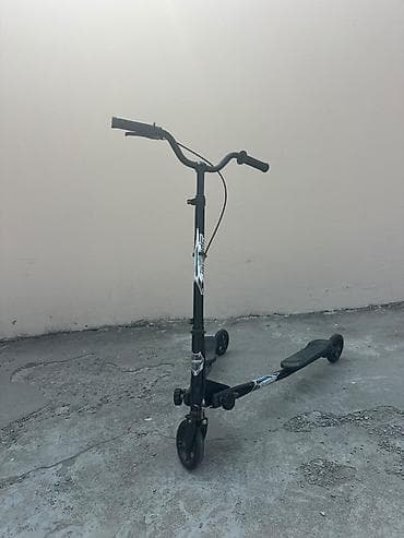 Üç təkərli “Scerider” skuter - Yan-yana iki ayaq platformalı, sürətli