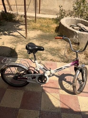 aurus велосипед: Stels markalı bu qatlanan velosiped ağ və bənövşəyi rəngdədir. Kiçik — 4