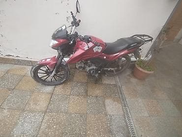 iki teker motor: Məhsul: Qırmızı rəngli yol motosikleti Xüsusiyyətlər: - Korpus — 2