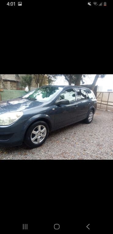 opel 1994: Opel Astra Caravan (universal kuzov) – tünd mavi rəng - Kuzov: 5 — 6