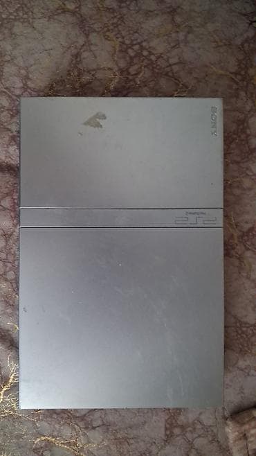 2 ci el 14 pro max: Sony PlayStation 2 Slim (gümüş rəng) Komplekt: - PS2 Slim konsolu — 4