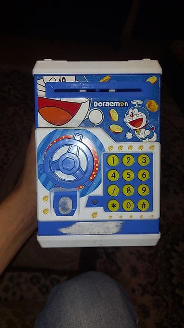 Doraemon dizaynlı uşaq pulqabısı-seyf. Plastik korpuslu bu oyuncaq