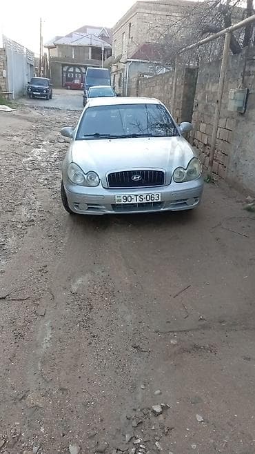 Hyundai Elantra (J3) sedan, gümüşü rəng. - Kuzov: 4 qapılı sedan