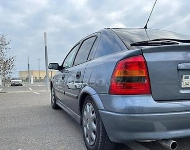 brabus disk: Opel Astra G sedan, tünd mavi rəng - Kuzov: 4 qapılı sedan, arxa şüşə — 4