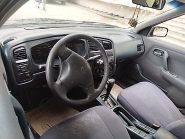 masin elani: Nissan Primera: 0.2 l | 1998 il Sedan — 4