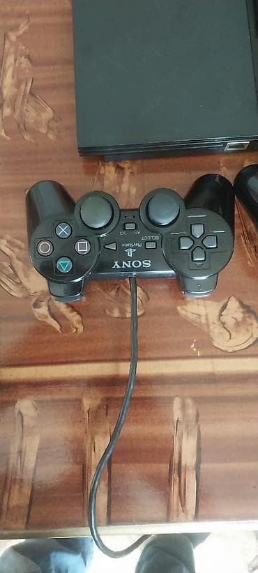 plesteşın 2: Se) Paketə daxildir: - PS2 Slim konsolu - 2 ədəd simli DualShock 2 — 2