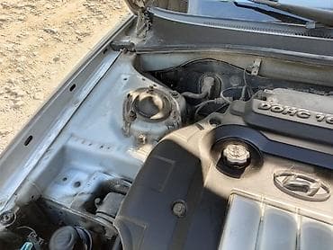 suktur: Hyundai Elantra (J3) sedan, gümüşü rəng. - Kuzov: 4 qapılı sedan — 2