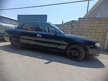 byd diski: Kia Clarus sedan sökülür - Kuzov: 4 qapılı sedan, tünd yaşıl rəng - — 4
