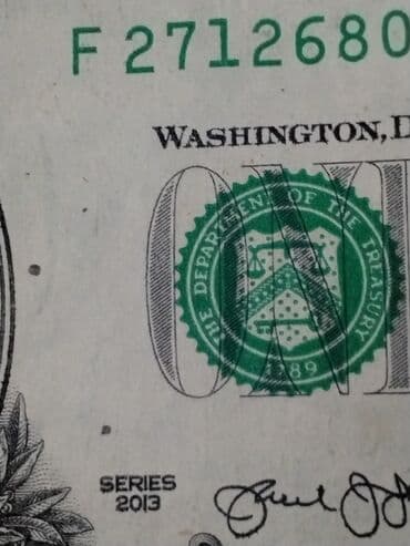 Məhsul: ABŞ 1 dollar banknotu. Cap zamani 2 balaca nöqtə cernil düşüb