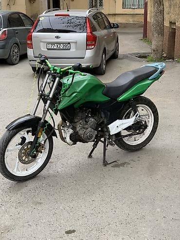 ucuz muraveyler: Motosiklet – küçə/naked üslubunda, yaşıl-qara rəng sxemi ilə. Texniki — 1